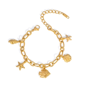 Detail of gold stainless steel ocean bracelet with starfish and shell pendants