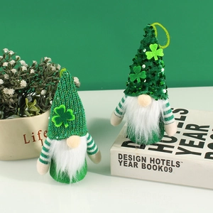 Green sequin gnome dolls for St. Patrick's Day with clover hats and striped arms