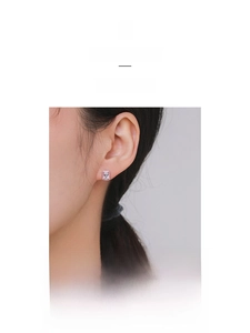 Close-up of a rectangular S925 silver stud earring with pink frame and clear zircon stone
