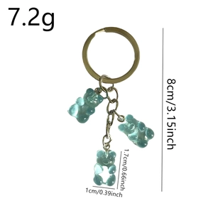 Colorful translucent blue gummy bear keychain with gold metal ring and size measurements