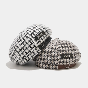 Houndstooth beret hat for women featuring a metal chain and leather trim detail