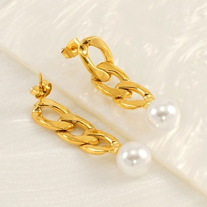 18K gold plated stainless steel Cuban chain earrings with white pearls on a textured background