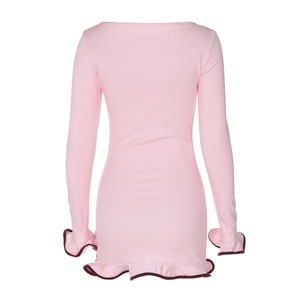 Detail of pink bodycon dress with burgundy ruffled hem and sleeves in soft knit fabric