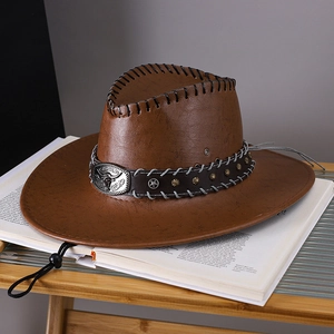 Detailed texture of brown retro leather cowboy hat with silver bull head buckle and studs
