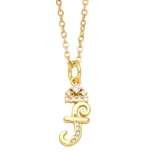 Close-up of golden letter f pendant with crown and sparkling crystals on O-chain