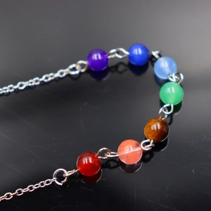 Handmade yoga chakra bracelet with seven colorful natural stone beads and silver chain