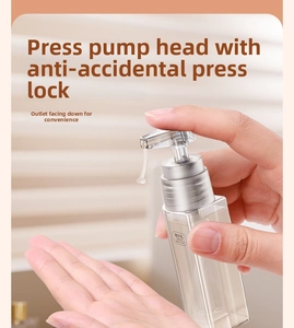 Detail of 35ml serum travel bottle with silver pump and safety clip held in hand