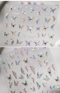 Detailed holographic 3D nail stickers featuring butterfly and tulip patterns with rhinestones