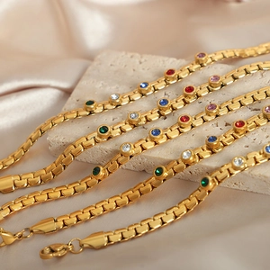 Luxe gold plated titanium steel bracelet set with colorful crystal gemstones and lobster clasp