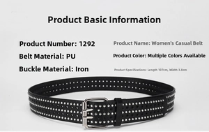 Detail of black PU leather punk belt with silver studs and star-shaped cutouts