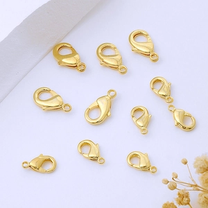 Flat lay of multiple 14K gold plated lobster clasps for jewelry making DIY projects