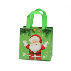 Green non-woven Christmas gift bag with Santa Claus print and sturdy top handles