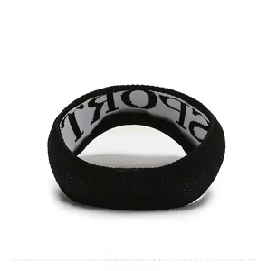 Close-up of black ribbed knit sports headband showing interior white lining with SPORT text
