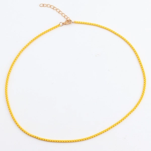 Detail of yellow candy color snake chain with gold extension link and lobster clasp