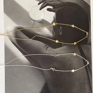 Artistic layout of 925 silver star pendant necklaces in gold and silver metal finishes