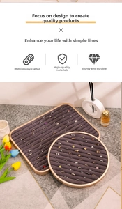 Macro detail of beige velvet jewelry display trays with gold metal frames and ring slots