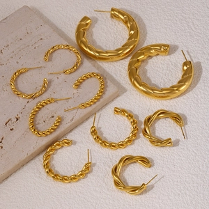 Golden textured hollow C-shaped geometric hoop earrings in various sizes on stone base