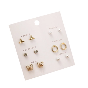 6-pair pearl and gold stud earring set for women displayed on a pink weekly card