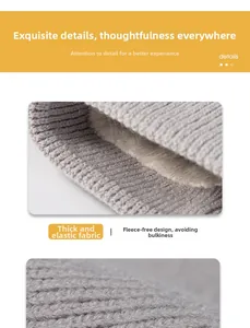 Close-up of thick grey cable knit fabric with soft cream fleece lining for winter warmth