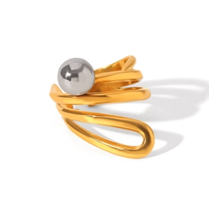 Detail of irregular multilayer golden ring with silver spherical bead accent on white background