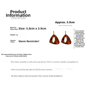 Detail showing vintage resin geometric triangle earring with dark brown tortoiseshell pattern