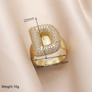 Detail view of gold letter D ring with zircon pavé, 22mm height and 18mm inner diameter