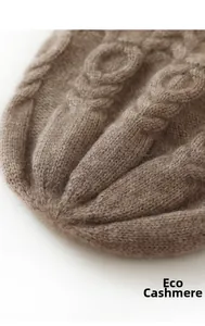 Detail of soft brown ecological cashmere beanie with cable knit texture and high quality wool