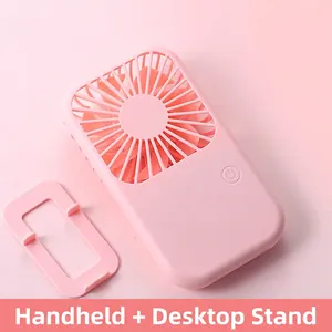 Pink portable handheld USB mini fan with a desk stand base and minimalist design