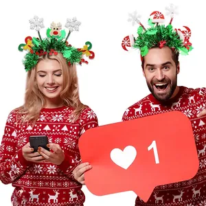 Christmas headbands with festive reindeer and mini hats worn by a model in holiday sweater