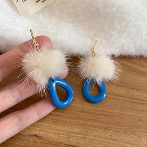 Elegant drop earrings with royal blue resin pendant and cream white faux fur ball charms