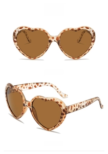 Detail of heart-shaped leopard print sunglasses with brown lenses from front and side angles