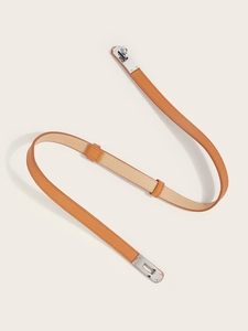 Detail of brown Saffiano leather belt with silver Kelly buckle in S-curve layout