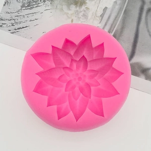Detail of pink silicone mold with lotus flower design for cake decorating and fondant