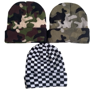 Knitted beanie hats in camouflage patterns and classic black and white checkerboard style
