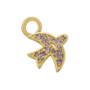 Close-up of golden swallow pendant with purple zircon inlay and connecting loop
