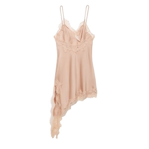 Detail of champagne satin slip dress featuring delicate lace trim and asymmetrical hemline