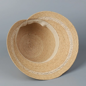 Elegant wide brim raffia sun hat with woven ripple edges and inner sweatband detail