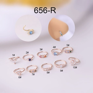 Detailed view of ten 0.8x8mm gold and rose gold nose rings with colorful zircons