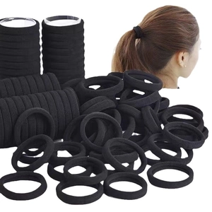 Pack of 4cm seamless high elasticity black fabric hair ties for women on white background