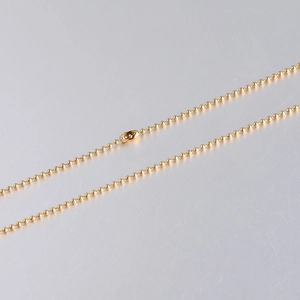 Close-up of a 1.5mm golden stainless steel ball chain with a secure connector clasp