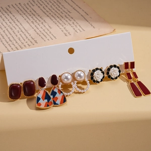 6-pair set of vintage geometric earrings with red resin and faux pearls on a card