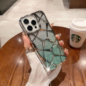 Detailed close-up of glittery silver-green geometric diamond texture on iPhone case