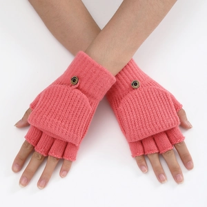 Detail of coral pink knitted convertible mittens showing fingerless design and flip cover