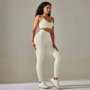 Detail of breathable jacquard knit texture on seamless off-white yoga set for women