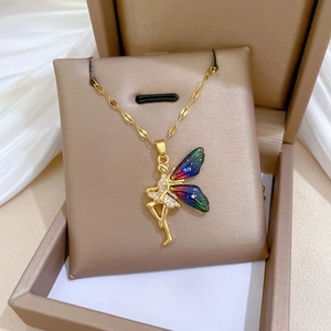 Close-up of fairy wing necklace with colorful enamel and sparkling crystals on a gift box