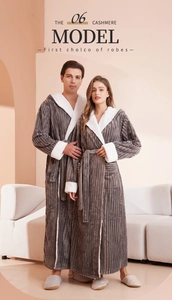 Detail of grey striped flannel bathrobe with white sherpa lining on hood and cuffs