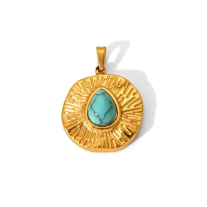 Detailed view of a gold circular pendant with a centered turquoise stone inlay