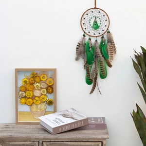 Ethnic dream catcher wall hanging with natural green feathers and wooden beads