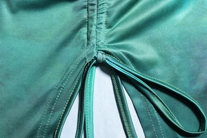 Detail of the drawstring closure on the teal gradient ribbed fabric with reinforced stitching