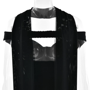 Detail view of the black mesh splicing and shoulder structure on this elegant tube dress